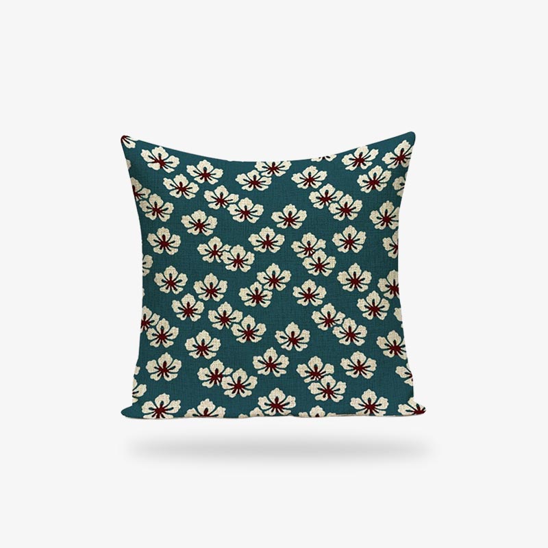 Une housse coussin cerisier japonais avec une impression de motifs sakura